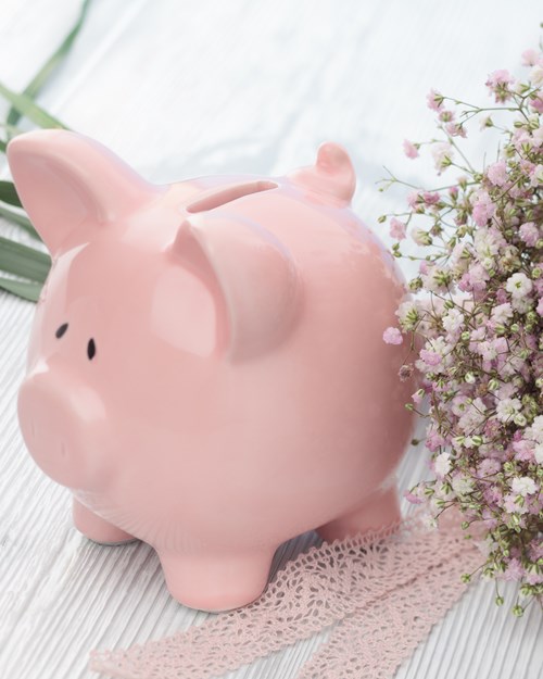 Piggy bank and a wedding bouquet 