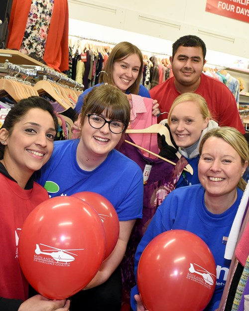The Tipton staff with Midlands Air Ambulance staff in Midlands Air Ambulance Charity Shop